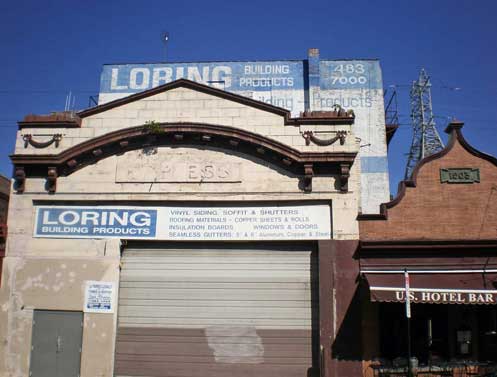 Figure 6 shows the last of the building supply companies that continue to operate on Main Street. When the business district started declining the reasonable rents or building costs attracted these uses. This company took over a former theater called the 'Empress'.
