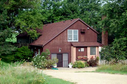 Figure 10. Residence within a considerably remodeled cheese factory in the Town of Verona in Dane County. Note the large chimney that is partly hidden by the foliage to the left of the main part of the building.