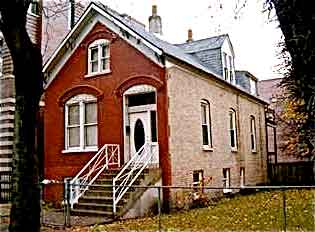 >Figure 8. After the Great Chicago Fire, many Worker Cottages were constructed of brick. This example, located on North Hoyne Street, was built circa 1890 (Urban Real Estate n.d.).